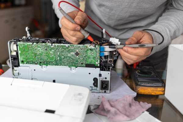 man-repairing-computer-part-in-service-center-rep-2025-03-13-01-01-18-utc