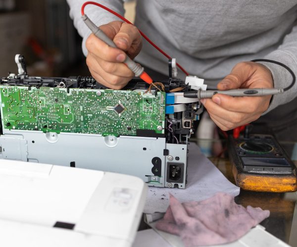 man-repairing-computer-part-in-service-center-rep-2025-03-13-01-01-18-utc